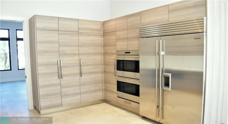 Photo from previously built Deerwood Model Home. Double Wolf Ovens - Imported Italian Cabinetry