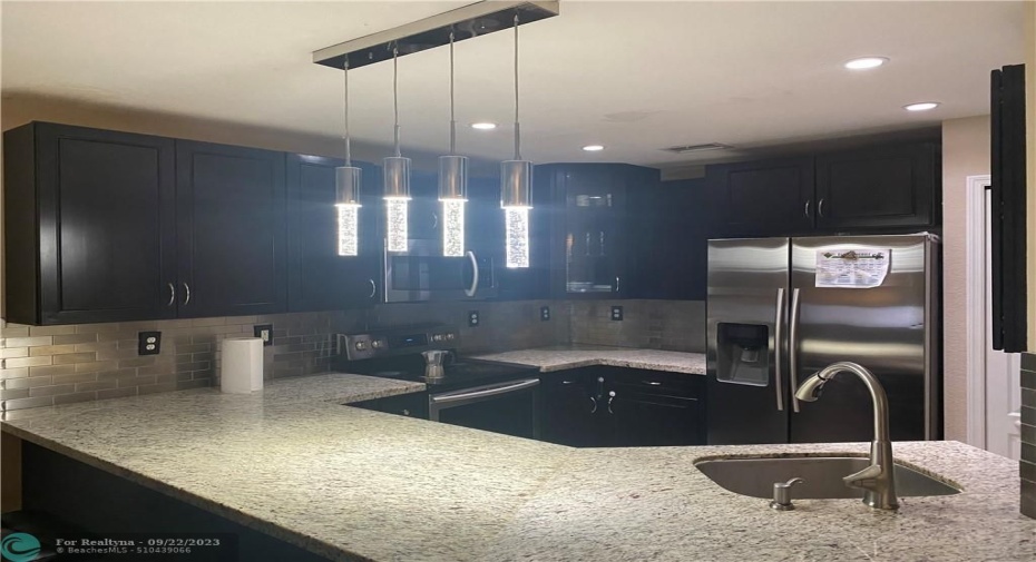 Updated kitchen with granite and stainless applicances
