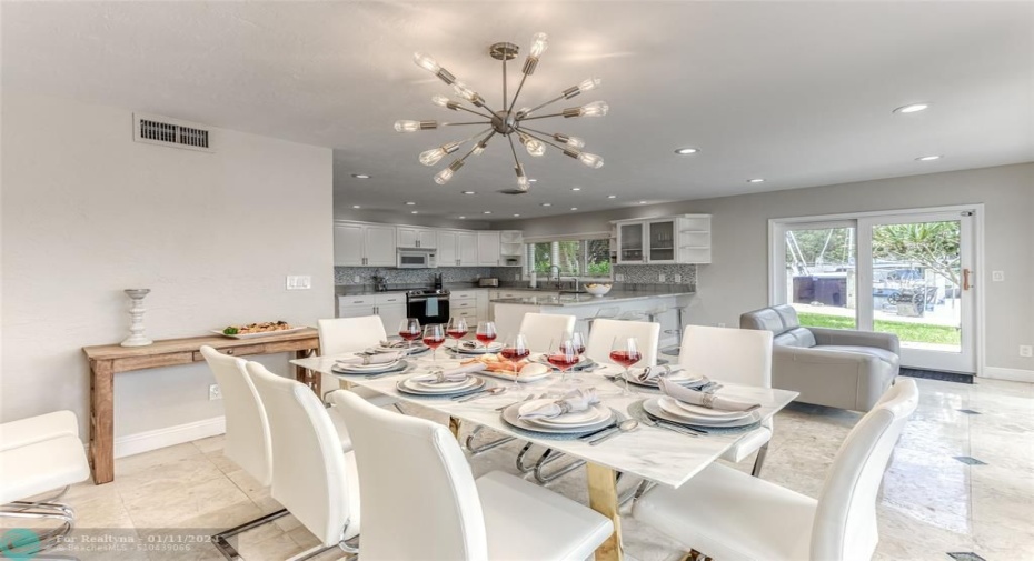 Dining Room Seating for 8 of Kitchen overlooking pool & waterway.