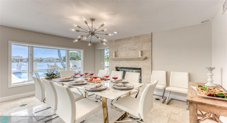 Dining Room Seating for 8 of Kitchen overlooking pool & waterway.