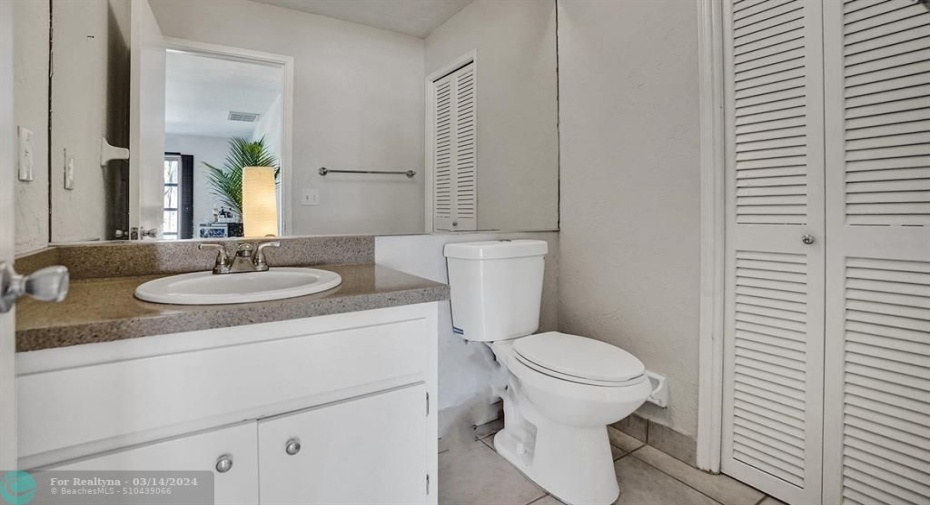 UNIT ALSO FEATURES A HALF BATH IN ADDITION TO FULL BATH.