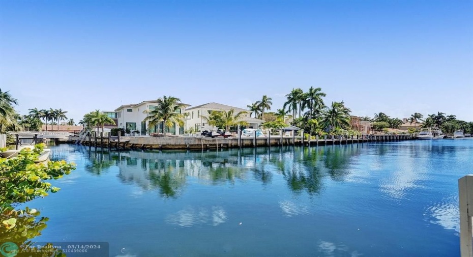 FROM THE POOL-SIDE, ENJOY THE MULTI-MILLION- DOLLAR MANSIONS SURROUNDING YOU.