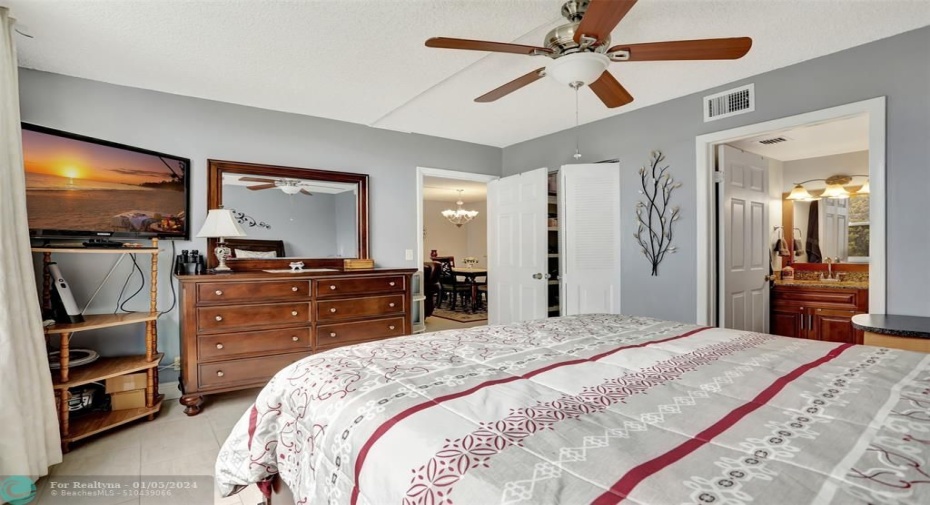 MAIN BEDROOM: TILE FLOORING; CEILING FAN REPLACED; RAISED PANNEL DOORS.