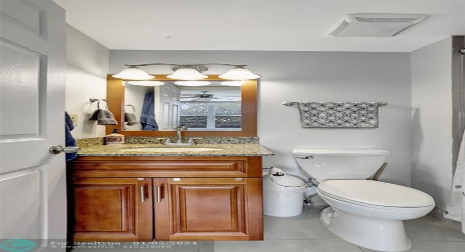 BATH FLOORING REPLACED, VANITY, COMMODE, MIRROR, AND LIGHT ALL REPLACED.