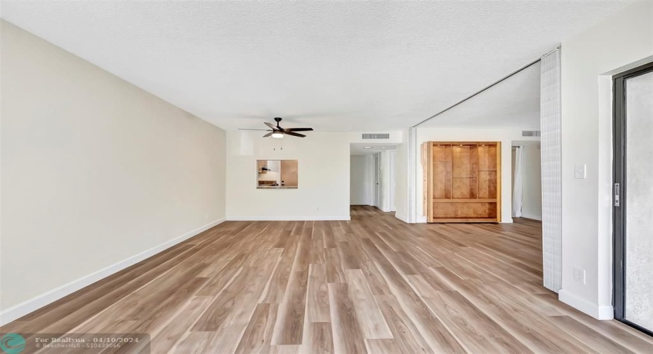 From the Living Room Window you are looking at the Dining Area with Pass-Thru Access To the Kitchen, to the Right is the 2nd Bedroom/Den (Convertible), 2nd Bedroom/Den has 