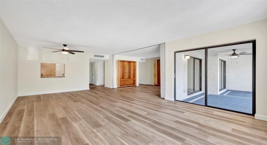 View from Living Room of Dining Area with Pass-Thru Access to the Kitchen, To the Right is the 2nd Bedroom/Den (Convertible), 2nd Bedroom/Den has 