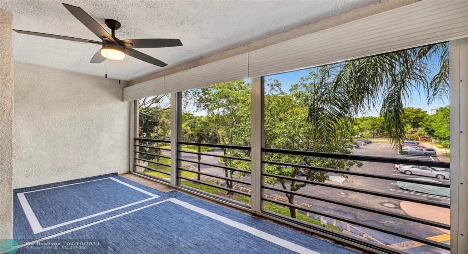 HUGE SCREENED-IN BALCONY that's 16' WIDE & is ACCESSIBLE from Living Room, Primary & 2nd Bedrooms, Balcony also includes ROLL-DOWN SHUTTERS & 1 of 3 NEW LED LIGHT CEILING FANS. FYI-The Due to Planned balcony work, association won't allow you to install flooring on the balcony for 6 months until work is completed. YOU WILL LOVE WHERE YOU LIVE & PLAY!