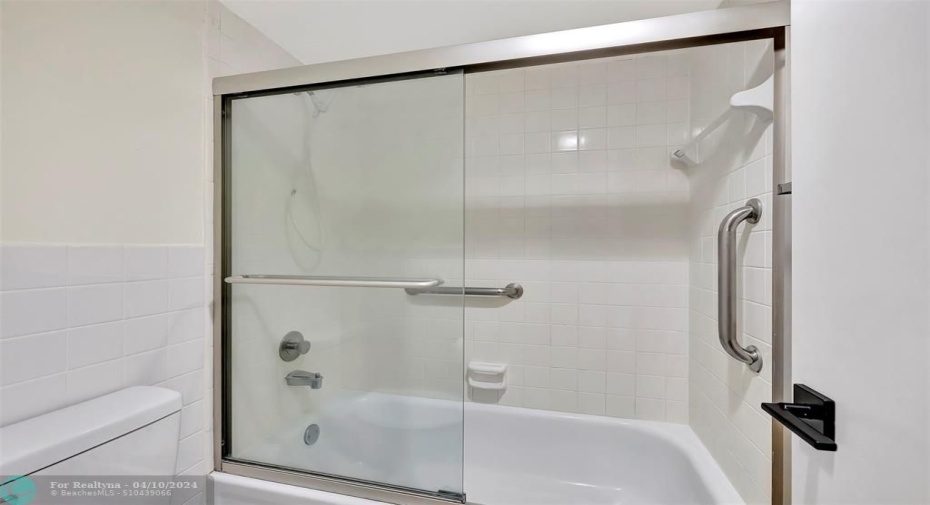 SEPARATE Room/Door for Bath & Toilet for Privacy. Primary En-Suite Bathroom Includes CUSTOM CABINETS (EXOTIC BURL VANEER), CUSTOM MIRROR (EXOTIC BURL VANEER), BRAND NEW TALL TOILET, GLASS ENCLOSED TUB/SHOWER COMBO and more than enough cabinet space as well as a Linen Closet in your Primary Bedroom.