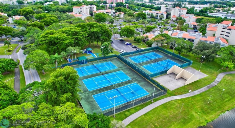 Right across the street from your building and the Clubhouse you will find, Tennis, Pickle-ball and Racquetball/Handball courts, a Playground and More! YOU WILL LOVE WHERE YOU LIVE AND PLAY!