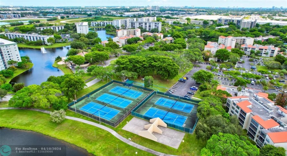 YOU WILL LOVE WHERE YOU LIVE AND PLAY! Right across the street from your building and the Clubhouse you will find, Tennis, Pickle-ball and Racquetball/Handball courts, a Playground and More!