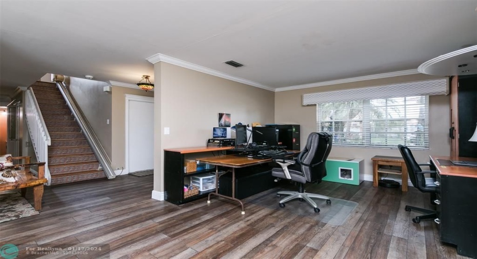 Formal living room  area currently used as a home office.