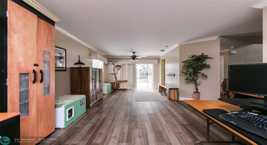 Long view of formal living room all the way to the formal dining room.