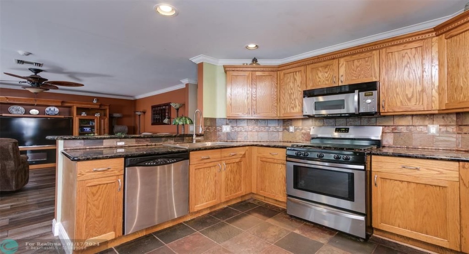 Kitchen also looking into family room