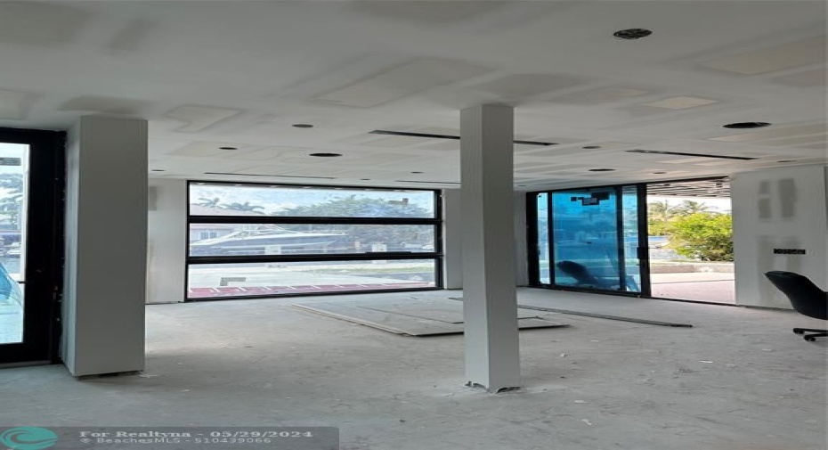 View from kitchen of the dining area and backyard