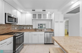 Gorgeous kitchen with tons of storage and white shaker cabinets