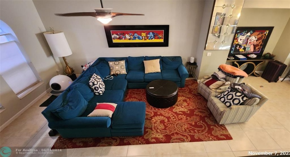 photo provided to display scale of living room. Property available only unfurnished.