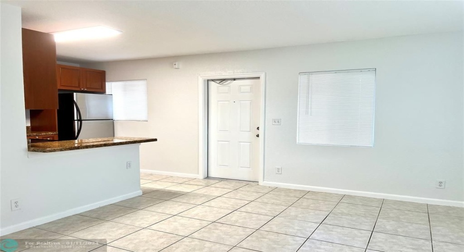 Kitchen breakfast bar and living room