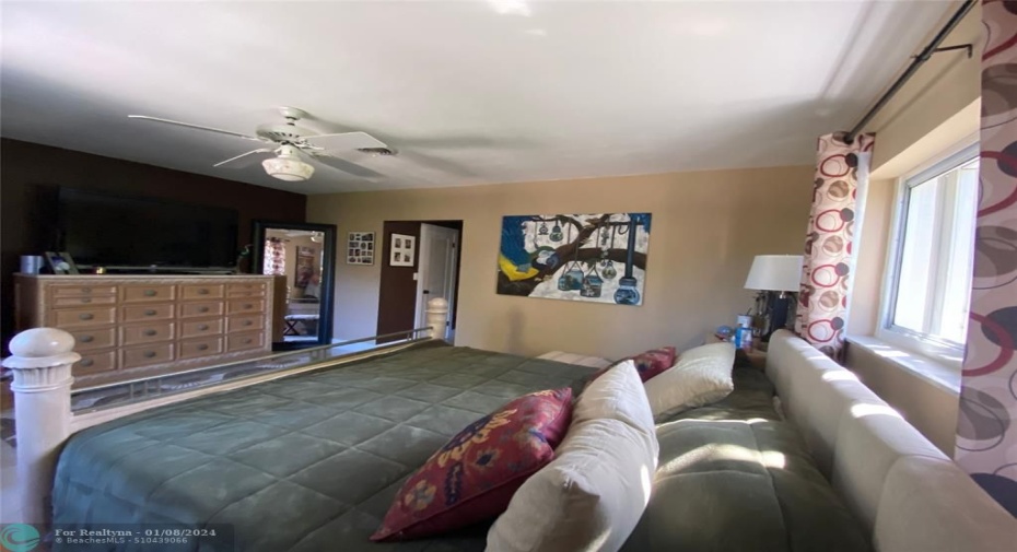 Spacious bedroom all restored terrazzo floors