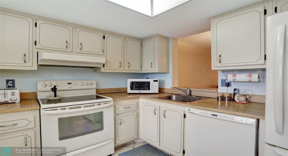 SMOOTH TOP RANGE,  ALLURE STOVE HOOD BY BROAN REFRIGERATOR WITH  FREEZER ON BOTTOM