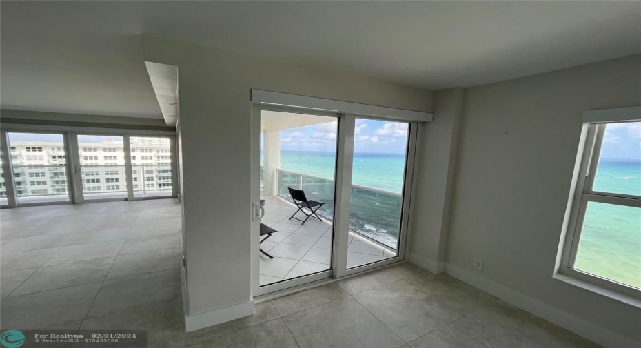Another point of entry to the balcony from the dining area through the impact sliding glass doors.