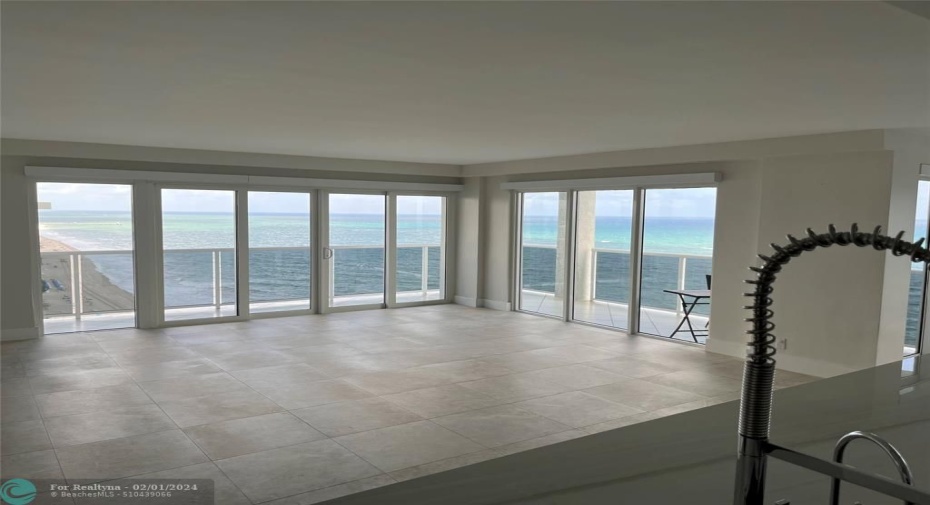 A view of the open floor plan from the kitchen/entry area