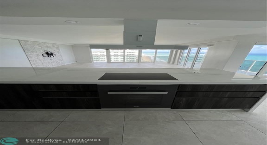Miele® Glass-top stove and another oven.