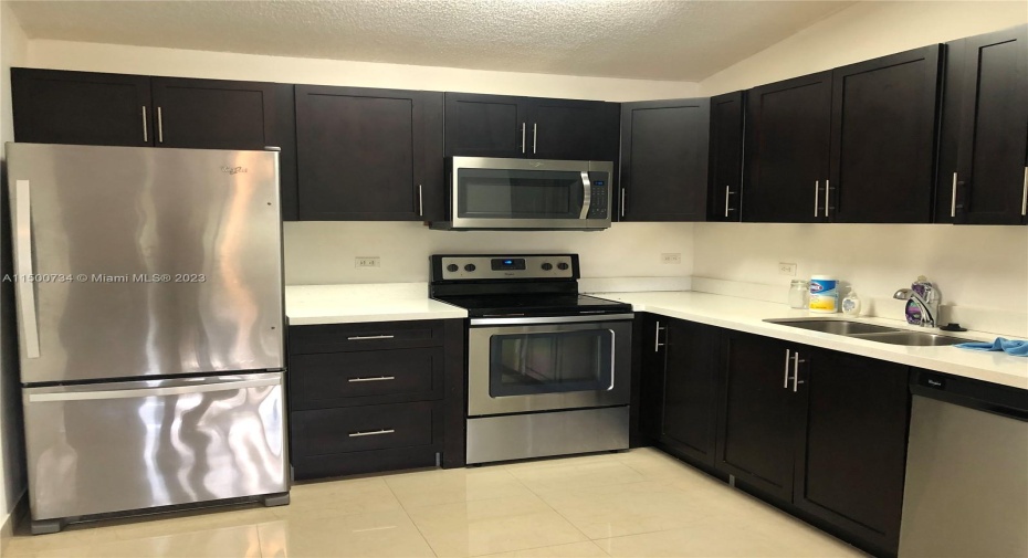 Update Kitchen with Quartz Countertop and Stainless Steel Appliances!