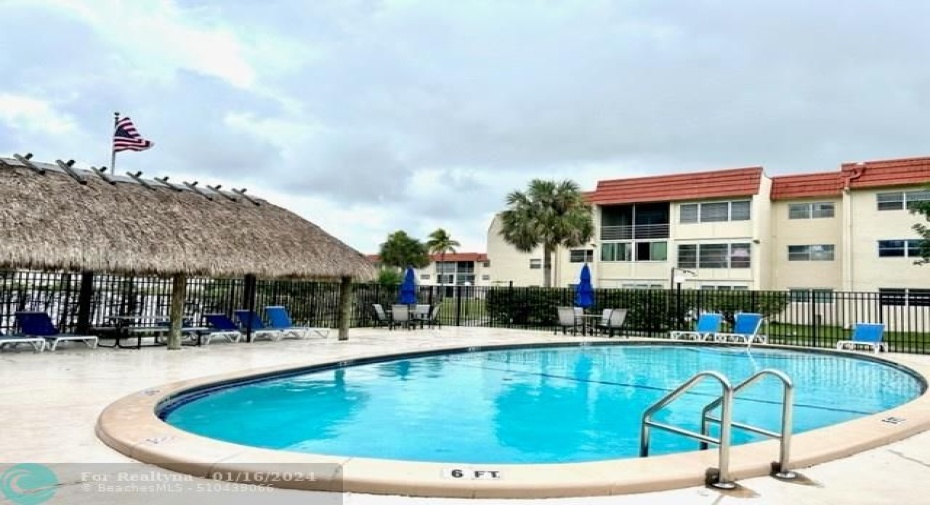 smaller pool and patio area next to building