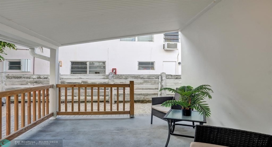 Rear Patio.Lots of room behind the wood fence.