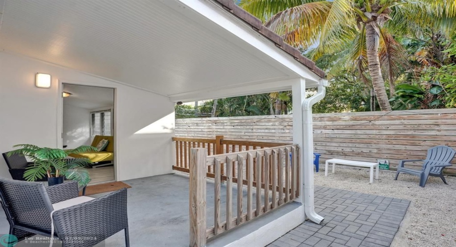 Rear Patio.Lots of room behind the wood fence.