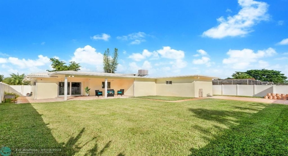 Back yard has patio and extra RV or boat parking