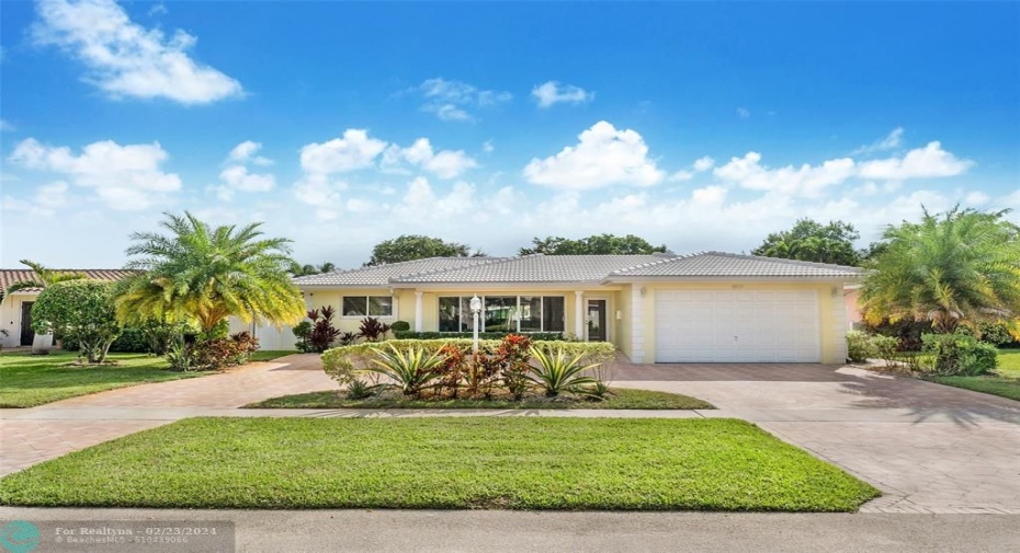 Lovely landscaped front of home with porch