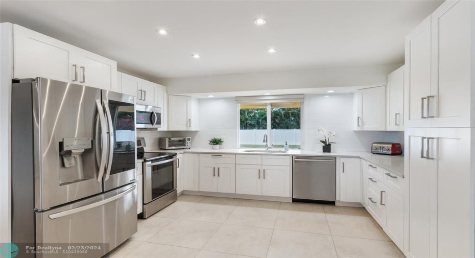 Granite, new backsplash, new cabinets and appliances
