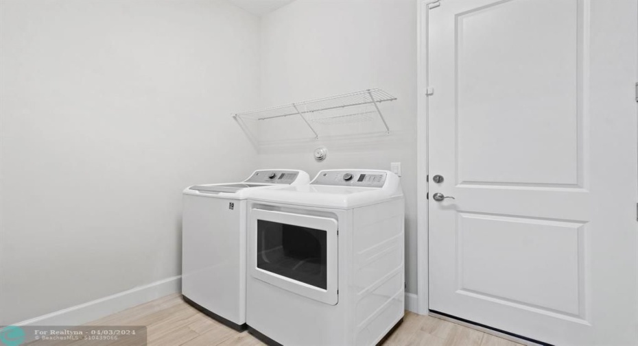 Laundry/Mudroom with entrance to 2nd Garage