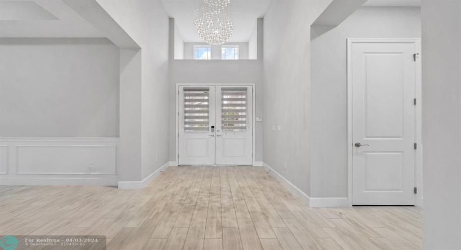 Entryway Foyer with Beautiful Chandelier and 20+ Ceiling