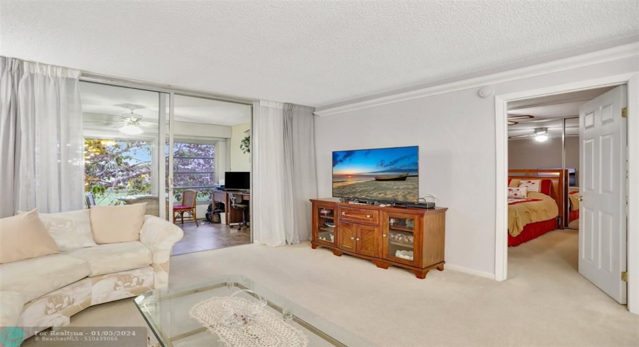 Views of balcony and master bedroom.