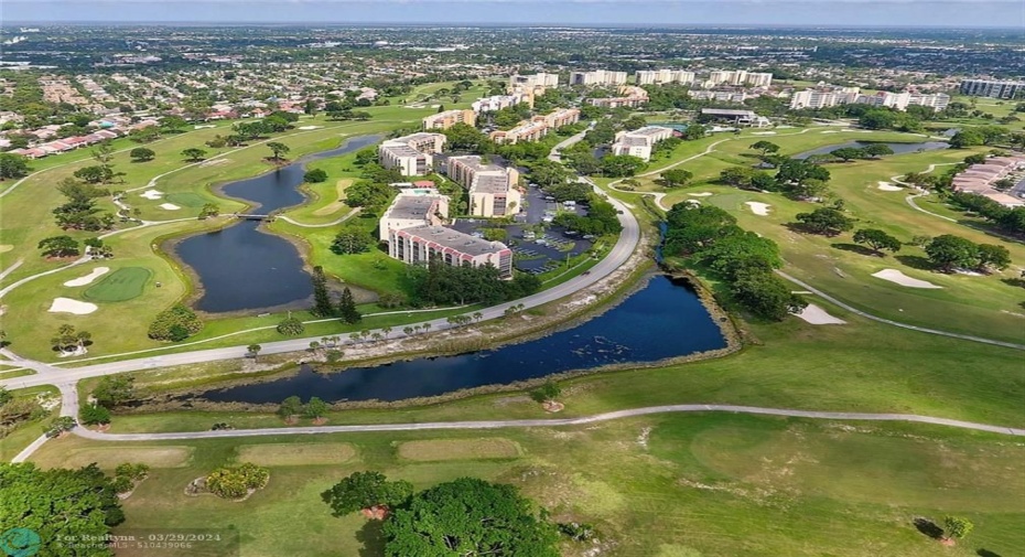 AERIAL VIEW -UNIT IS LOCATED IN MIDDLE BUILDING SURROUNDED BY GREEN SPACE
