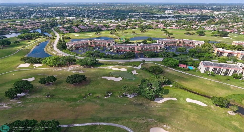 AERIAL VIEW - UNIT IS LOCATED IN MIDDLE BUILDING SURROUNDED BY GREEN SPACE