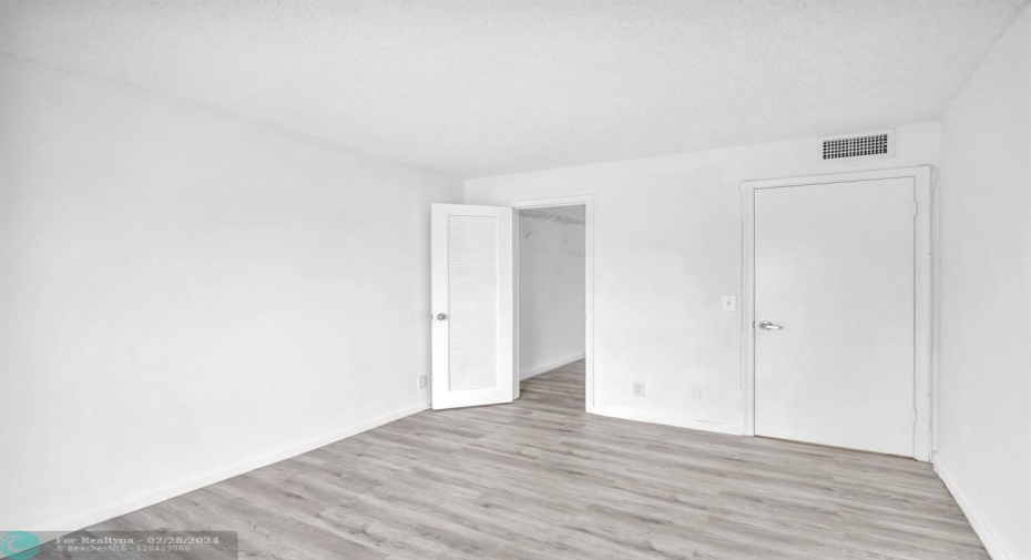 Bedroom with walk in closet