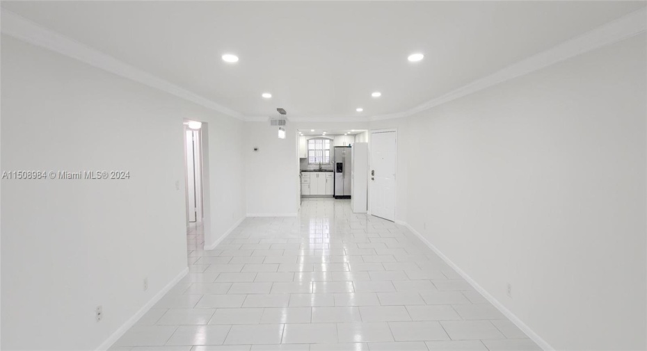 view of living room from the back of the unit. Gorgeous Ceiling Lights.