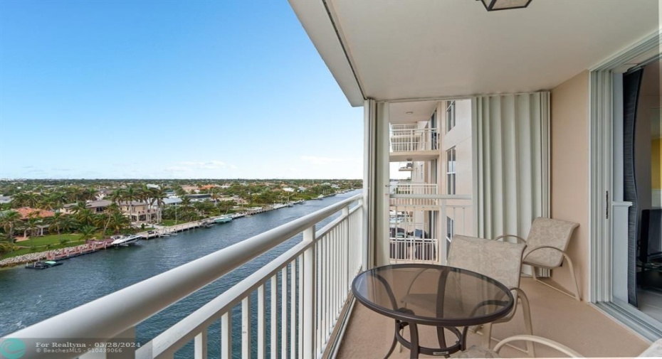 The balcony provides the perfect setting for an alfresco dining or simply unwinding as you watch the sunset over the shimmering waters.
