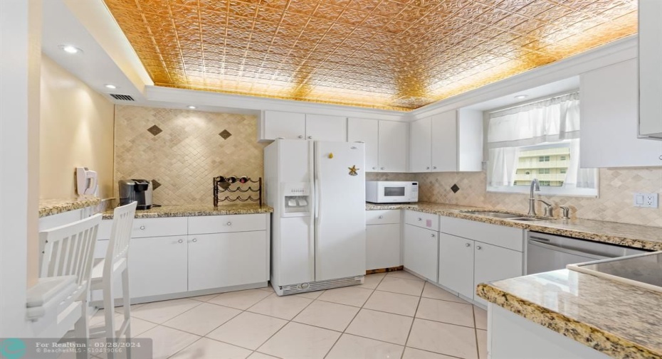 Ample counter space and storage, modern updates and has view of the ocean through the kitchen window.