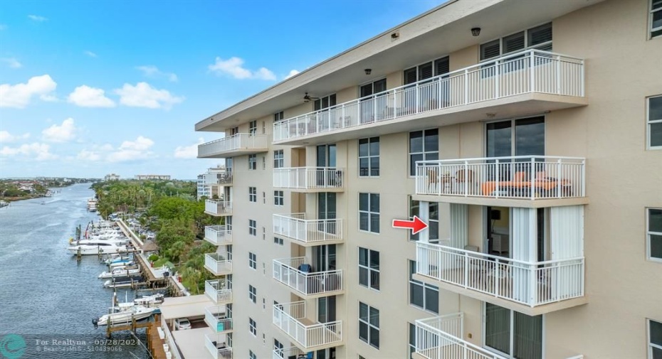 The balcony provides the perfect setting for an alfresco dining or simply unwinding as you watch the sunset over the shimmering waters.