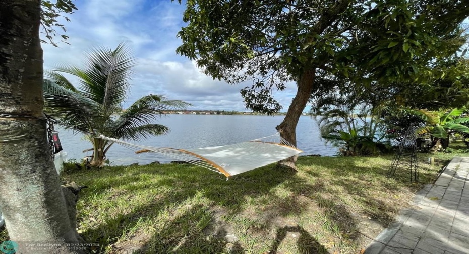 Backyard opens up to a huge private lake