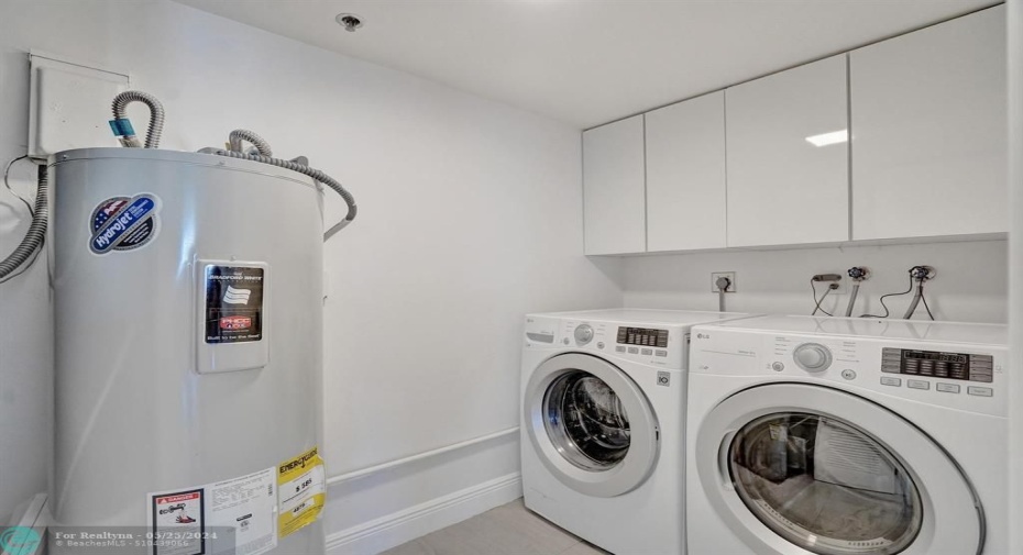 In-unit laundry room next to kitchen/powder room.