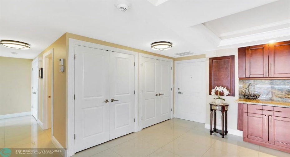 Very large storage closet/adjacent closet holds hot water heater and A/C condenser.