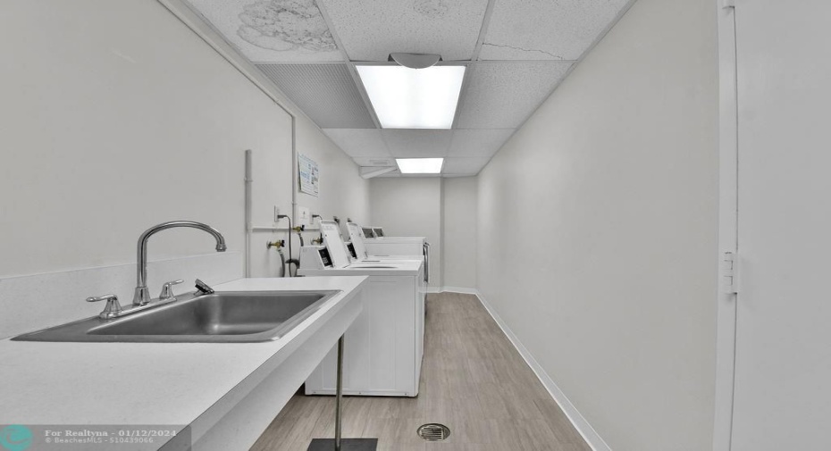 Utility Room with Sink and Washer/Dryers