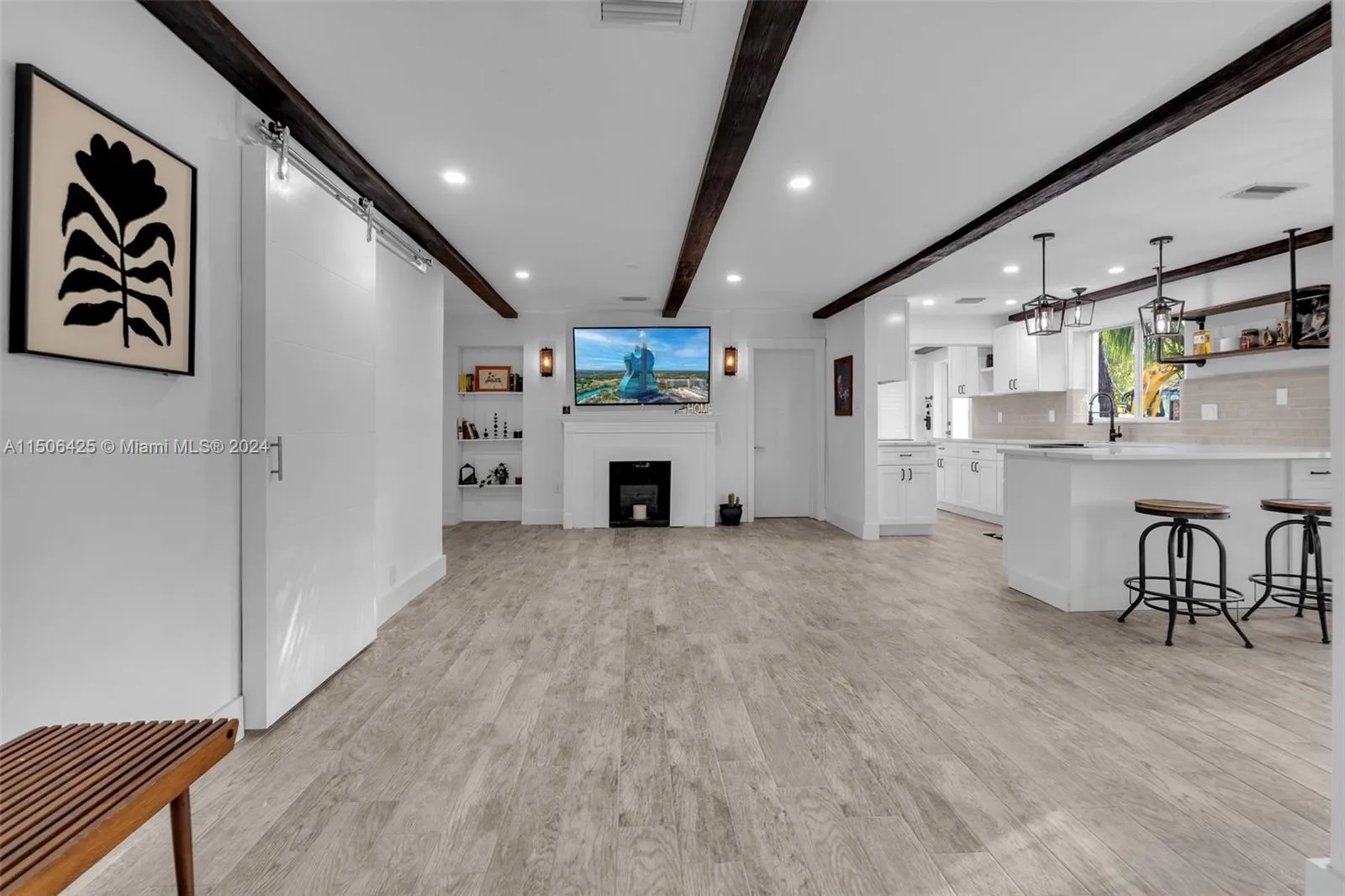 Open floor plan, wood burning fireplace, tiled floors. 
