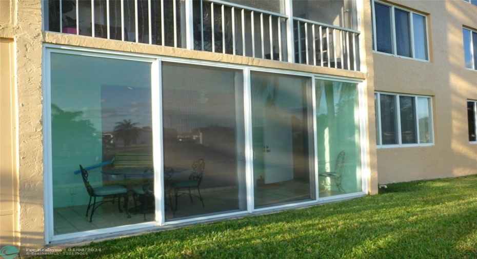 ENCLOSED PATIO-IMPACT SLIDING GLASS DOORS;IMPACT WINDOWS IN LIVING ROOM