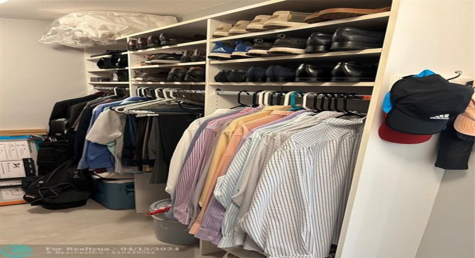 Primary bedroom walk-in closet